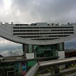 P107 The Peak Tower with its stylish architectural wok-like top... Peak Tower incorporates the upper station of the Peak Tram, the funicular railway transporting...